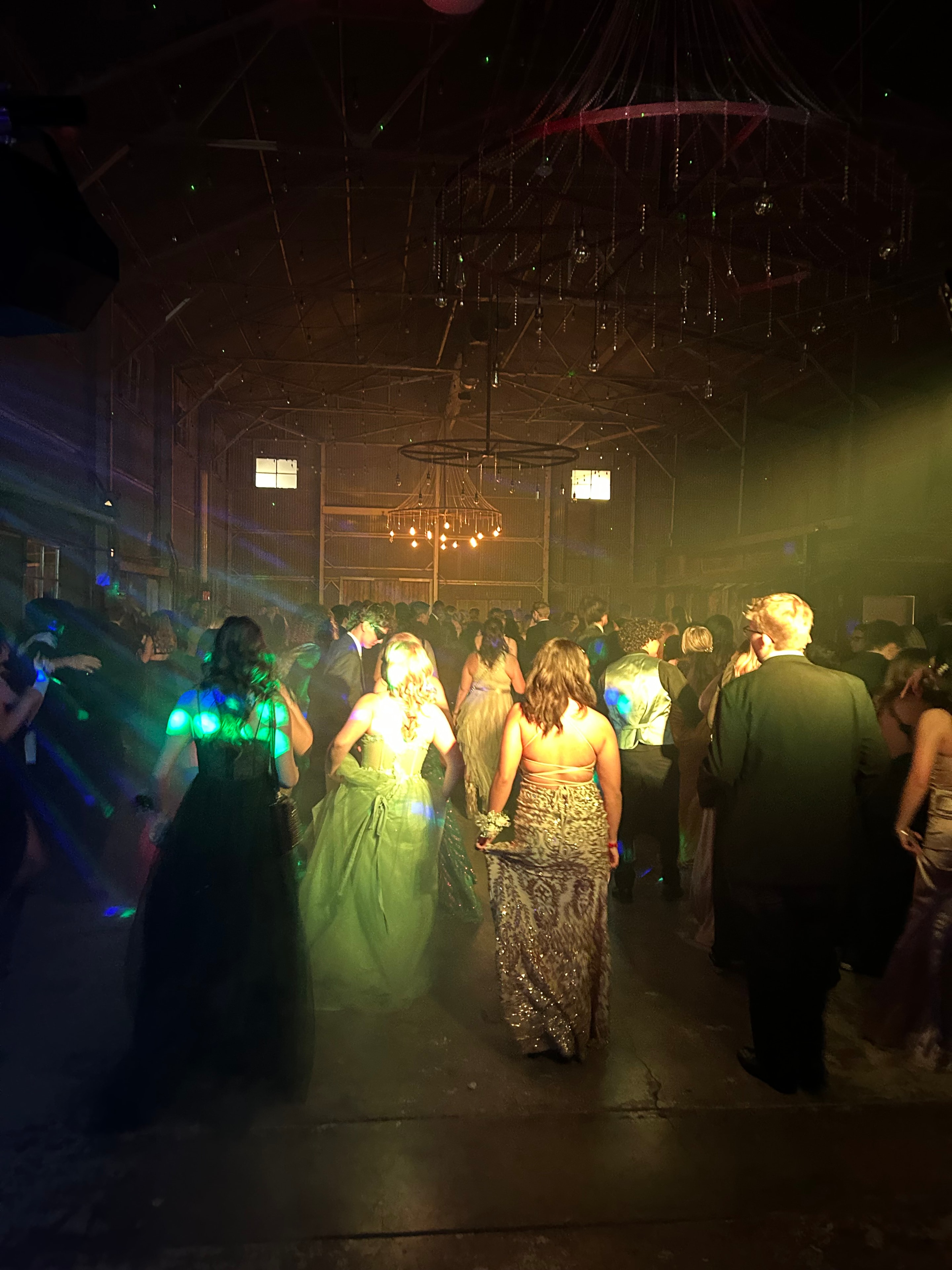 Birthday party guests dancing with neon lights